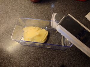 Sliced potatoes in a mandoline.