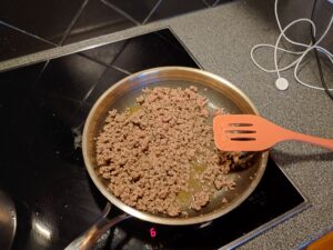 A skillet with fried minced meat.